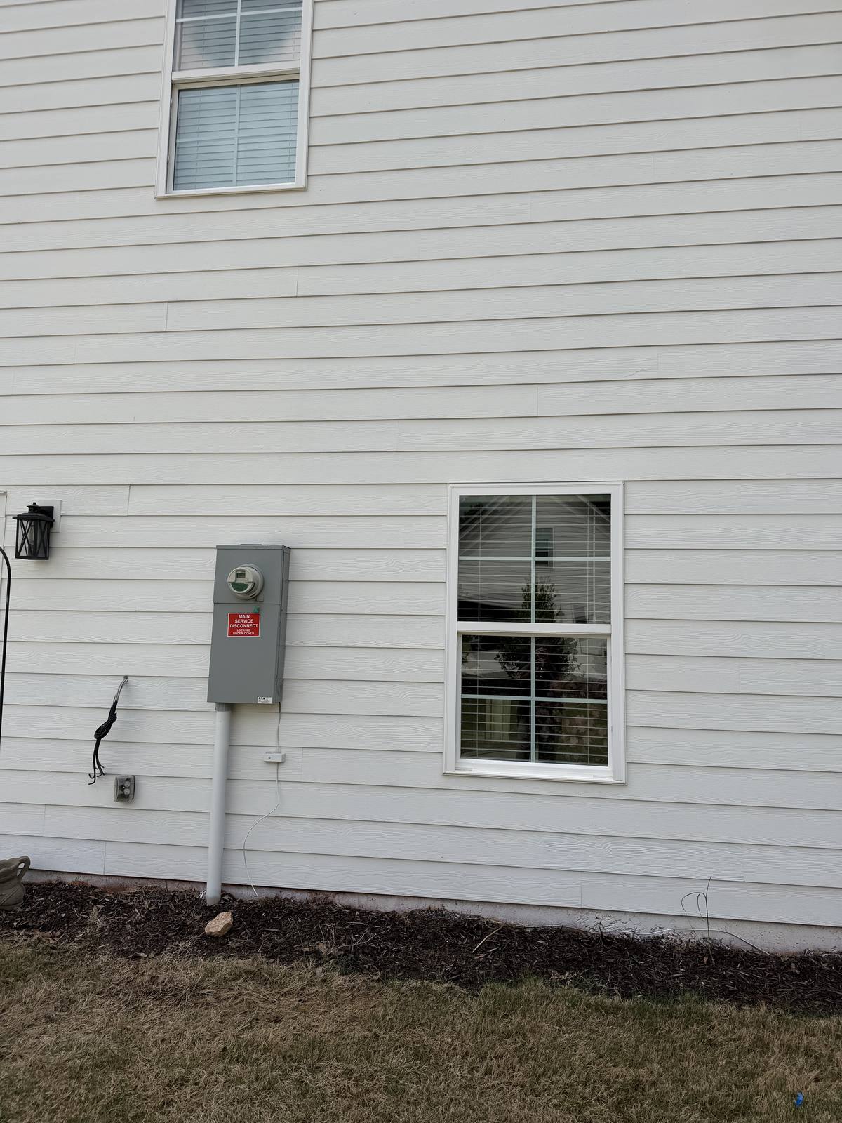 After house washing — clean Hardie board siding