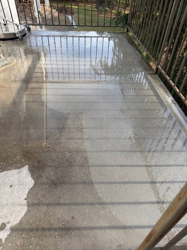 Balcony concrete cleaning showing clean vs dirty in same shot