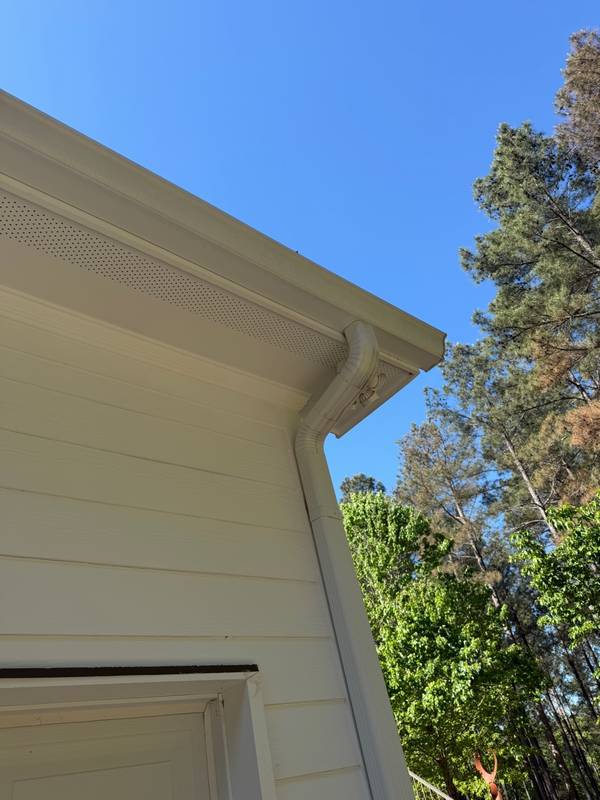 Clean downspout and gutter corner after professional cleaning