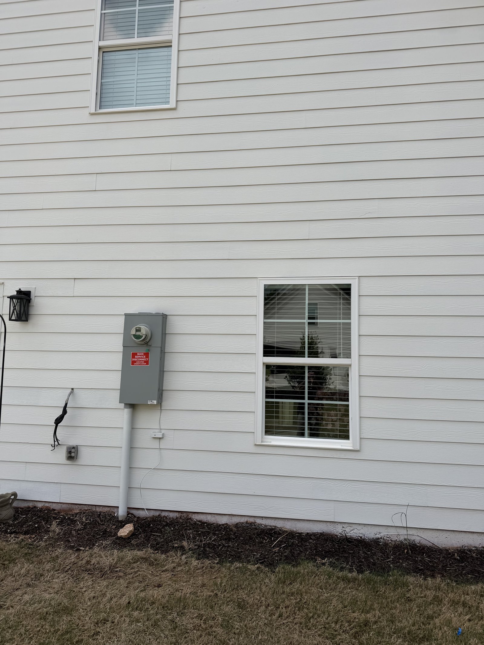 Clean white siding after Piedmont Exterior soft wash service