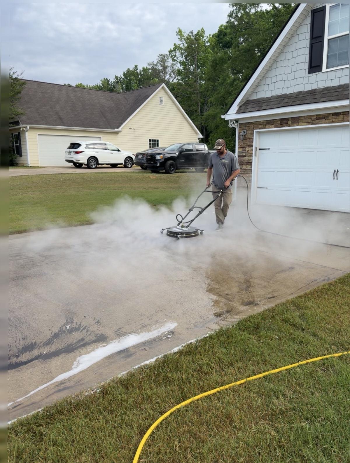 Piedmont Exterior pressure washing a driveway in North Georgia