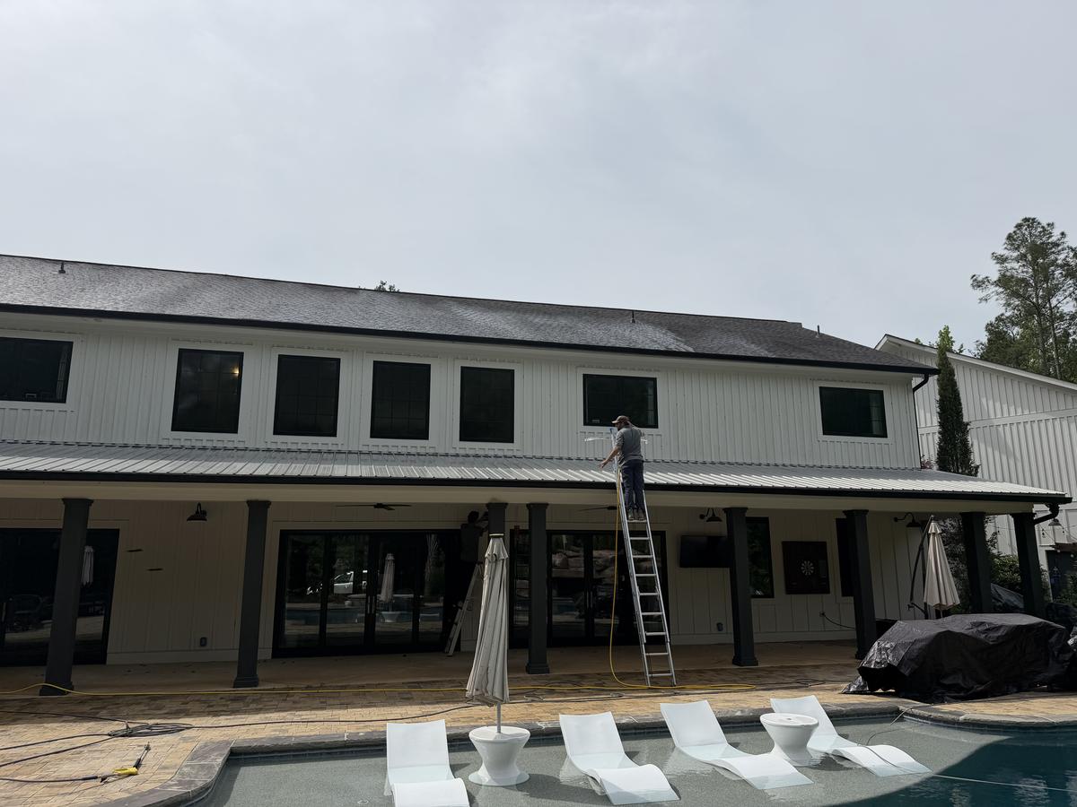 Piedmont Exterior soft washing a pool house roof in North Georgia