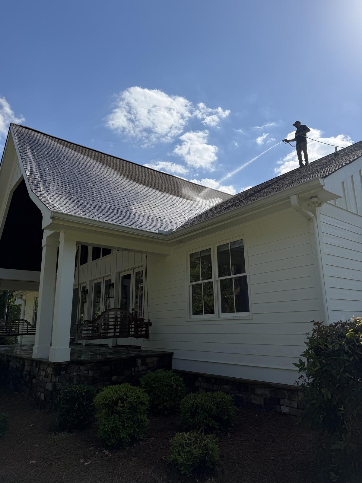 Piedmont Exterior soft washing a shingle roof in North Georgia