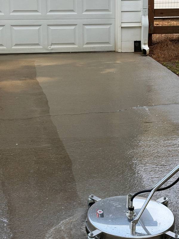 Piedmont Exterior surface cleaner showing a clean line on a commercial pavement surface
